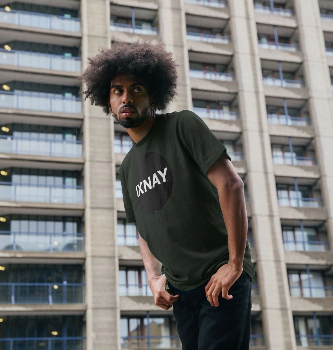 Black man wearing a dark gray Printed Men's T-Shirt with Original Black Round IXNAY Logo to represent the artist and musician IXNAY