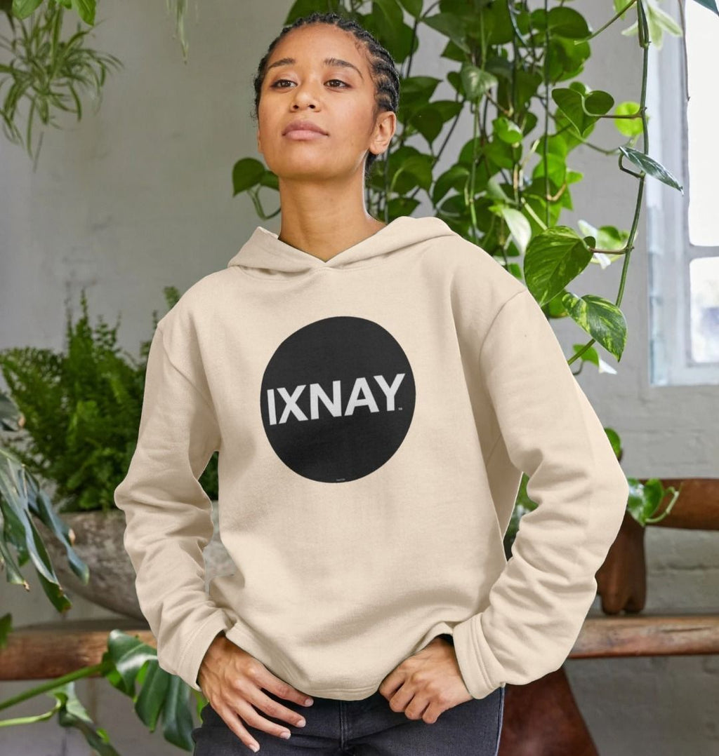 beautiful black woman with cornrows wearing womens oat colored light beige organic pullover hoodie with original black round IXNAY logo